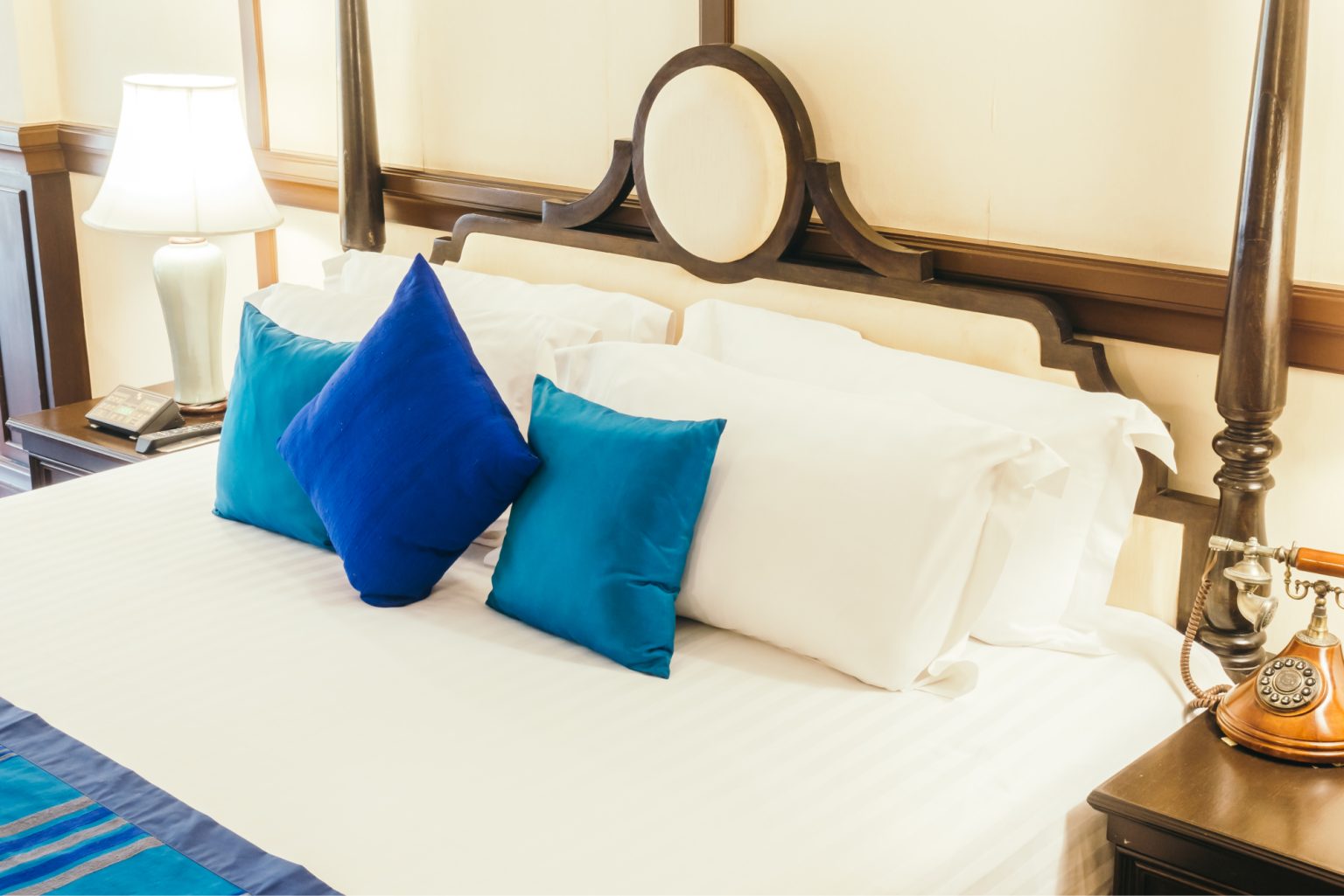 Beautiful luxury Pillow on bed with light lamp decoration in bedroom interior - Vintage Light Filter